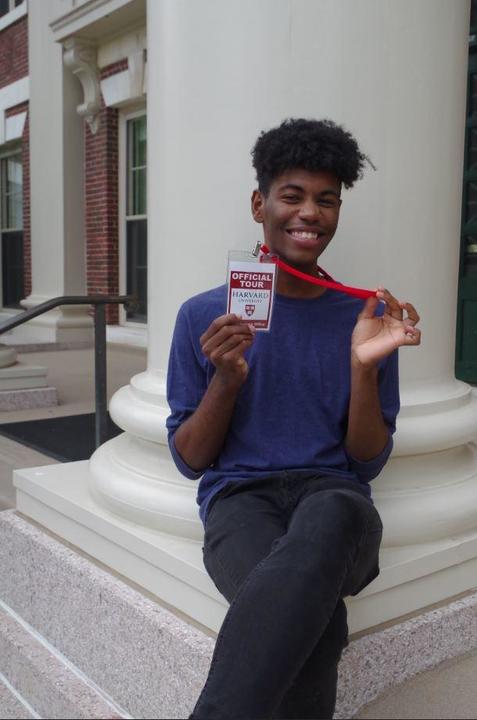 student with badge