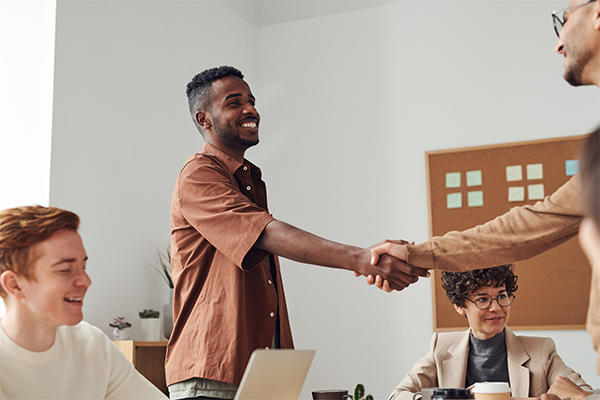 student and employer shaking hands